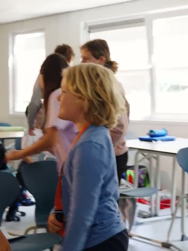 Students thinking, laughing and solving problems alongside each other