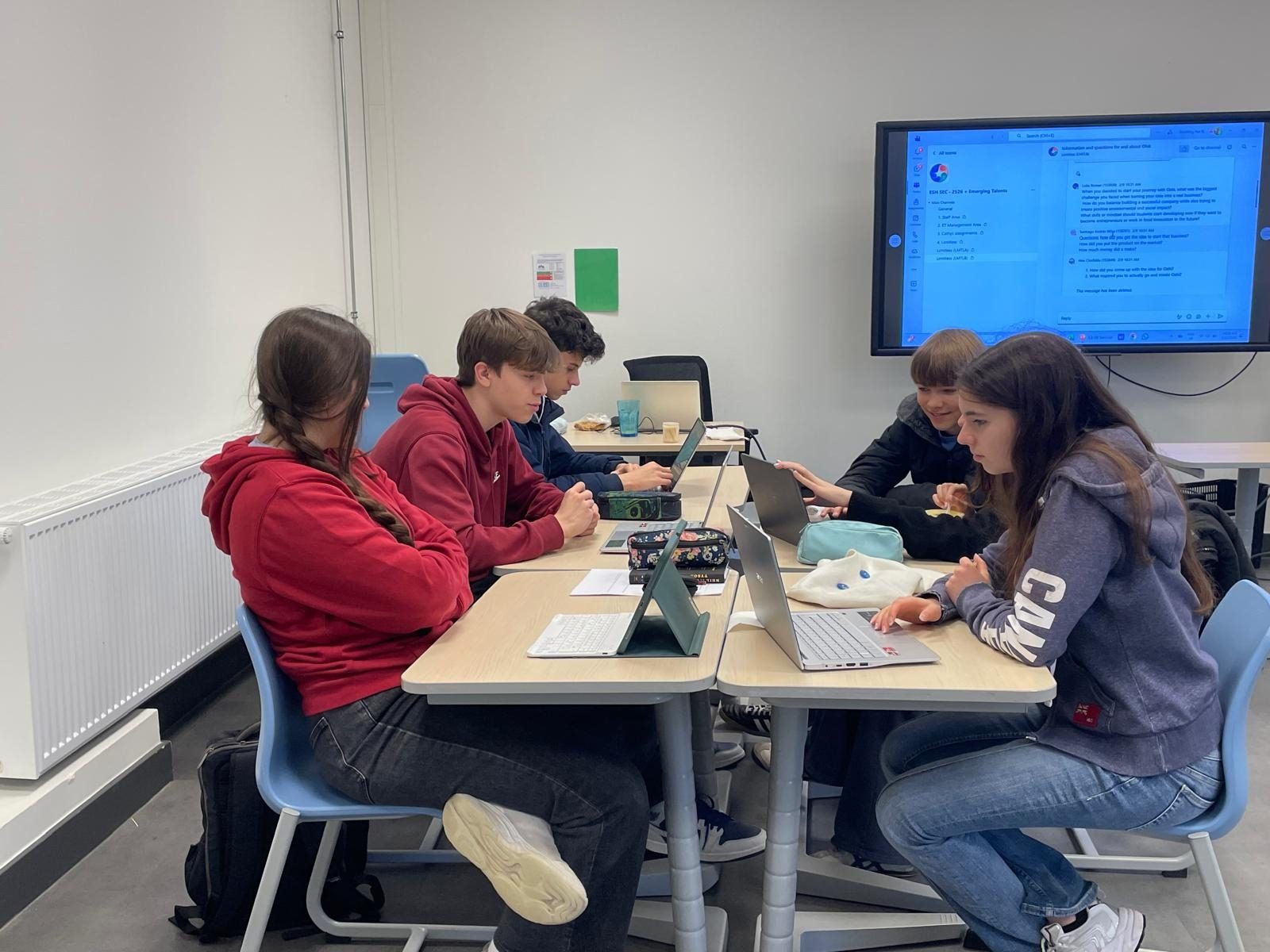 Students working on their own projects on laptops during a session